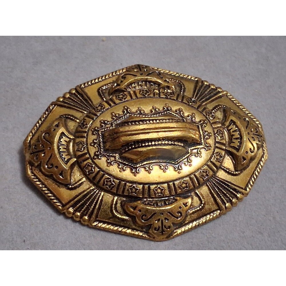 Ornate brass Etruscan revival sash pin brooch, stamped symbols, intricate design